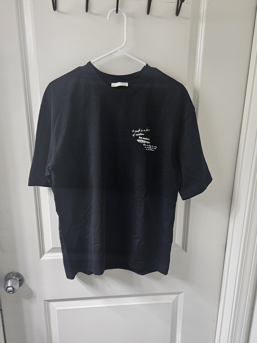 Zara Black Short-Sleeve Tee with Small White Chest Graphic